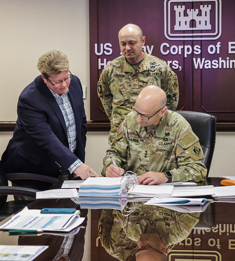 LTG Spellmon signs the Ponte Vedra Beach CSRM Chief's Report April 18, 2024